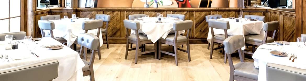 Tables laid for service in the dining room at La Nouvelle Maison